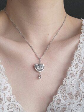 Silver heart necklace with a small silver chain